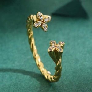 NWOT 18k gold plated stainless steel zirconia clover adjustable ring